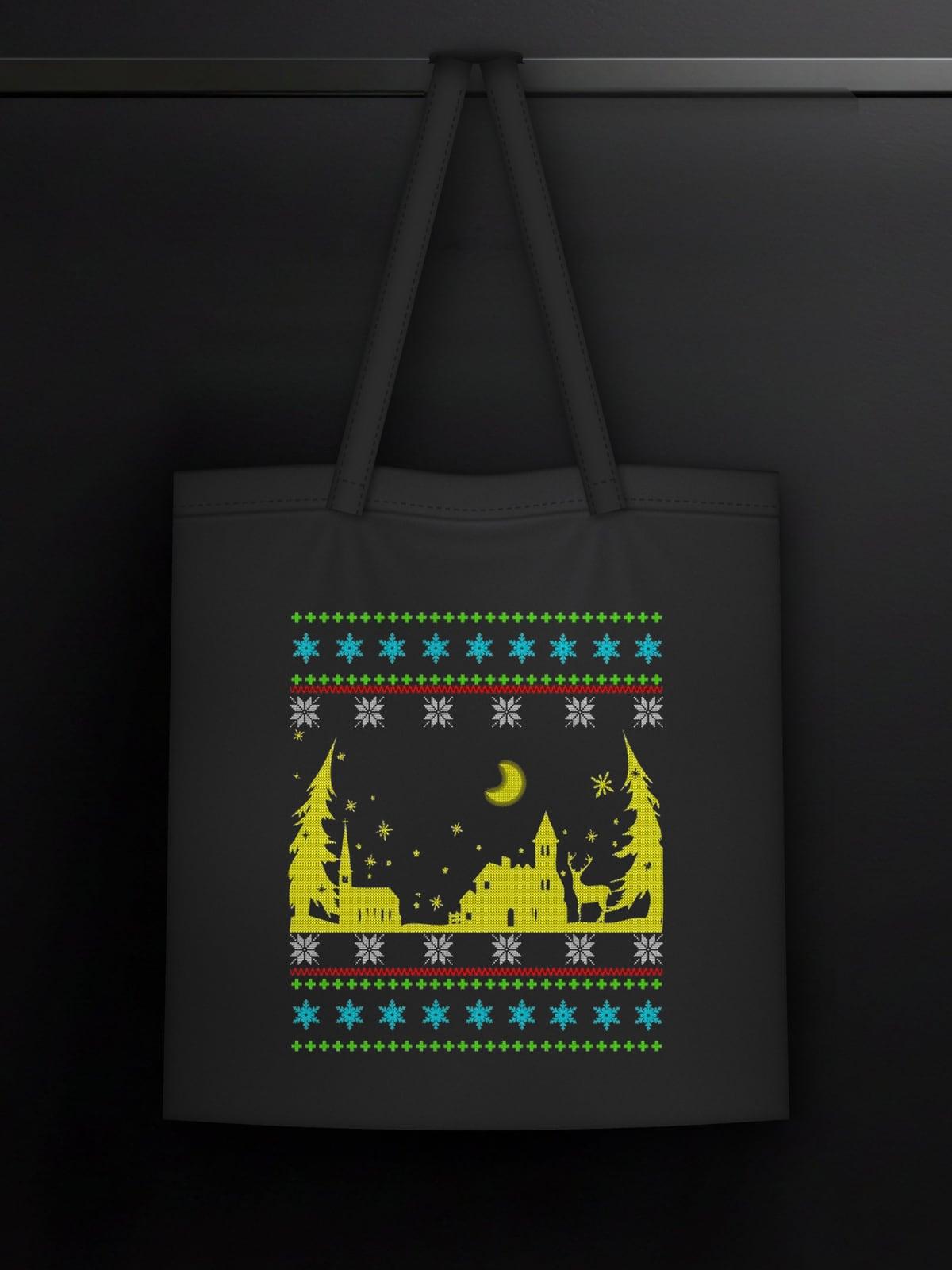 Black tote bag with a knitted-style Christmas village print